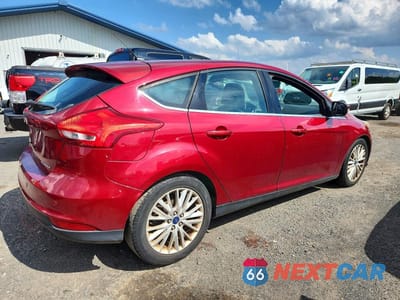 Trzecie zdjęcie samochodu z tyłu: 2015 FORD FOCUS TITANIUM VIN:1FADP3N23FL227091 - miniatura