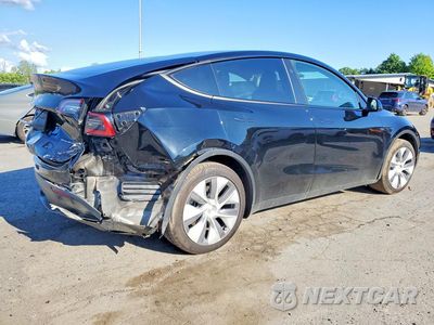 Trzecie zdjęcie samochodu z tyłu: 2023 TESLA MODEL Y VIN:7SAYGAEE1PF927919 - miniatura