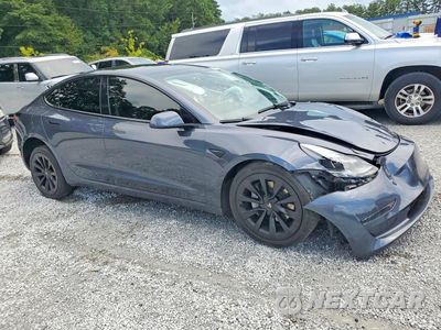 Czwarte zdjęcie samochodu z boku: 2023 TESLA MODEL 3 VIN:5YJ3E1EB2PF391582 - miniatura