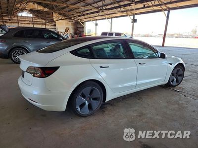 Trzecie zdjęcie samochodu z tyłu: 2023 TESLA MODEL 3 VIN:5YJ3E1EB4PF388862 - miniatura
