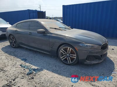 Czwarte zdjęcie samochodu z boku: 2022 BMW M850XI VIN:WBAGV8C09NCJ45647 - miniatura