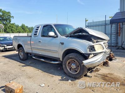 Czwarte zdjęcie samochodu z boku: 2001 FORD F150 VIN:2FTRX18W21CA54363 - miniatura