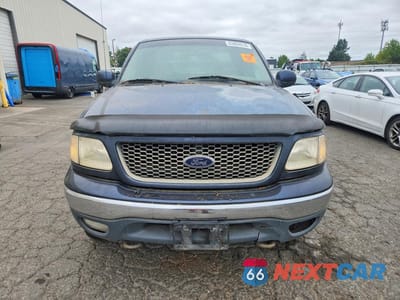 Piąte zdjęcie samochodu w środku: 2000 FORD F150 VIN:1FTRX18L2YNA44491 - miniatura