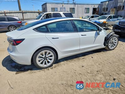 Trzecie zdjęcie samochodu z tyłu: 2023 TESLA MODEL 3 VIN:5YJ3E1EA7PF446843 - miniatura