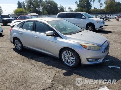 Czwarte zdjęcie samochodu z boku: 2015 FORD FOCUS TITANIUM VIN:1FADP3J23FL256211 - miniatura