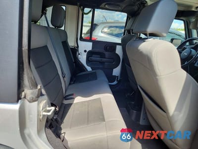 Zdjęcie 10 z 12 samochodu: 2010 JEEP WRANGLER UNLIMITED RUBICON VIN:1J4BA6H18AL133962 - miniatura
