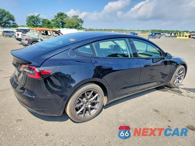 Trzecie zdjęcie samochodu z tyłu: 2023 TESLA MODEL 3 VIN:5YJ3E1EA9PF453129 - miniatura