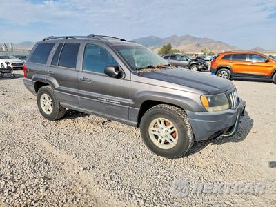 Czwarte zdjęcie samochodu z boku: 2004 JEEP GRAND CHEROKEE LAREDO VIN:1J4GW48N04C370562 - miniatura