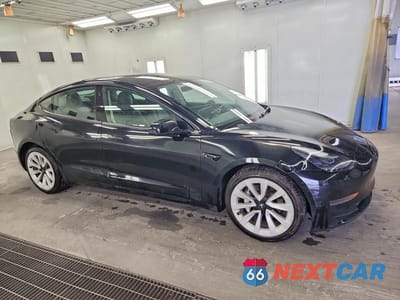 Czwarte zdjęcie samochodu z boku: 2023 TESLA MODEL 3 VIN:5YJ3E1EA8PF451310 - miniatura