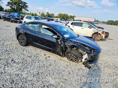 Czwarte zdjęcie samochodu z boku: 2023 TESLA MODEL 3 VIN:5YJ3E1EB4PF691009 - miniatura