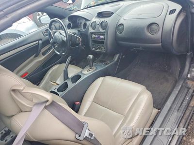 Zdjęcie 8 z 12 samochodu: 2003 MITSUBISHI ECLIPSE SPYDER GS VIN:4A3AE45G73E176213 - miniatura