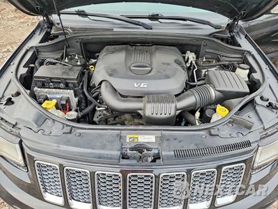 Zdjęcie 12 z 14 samochodu: 2015 JEEP GRAND CHEROKEE SUMMIT VIN:1C4RJEJGXFC808294 - miniatura