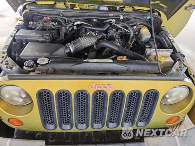 Zdjęcie 11 z 12 samochodu: 2008 JEEP WRANGLER UNLIMITED SAHARA VIN:1J4GA591X8L551920 - miniatura