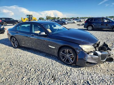 Czwarte zdjęcie samochodu z boku: 2014 BMW 750 LI VIN:WBAYE8C55ED135188 - miniatura