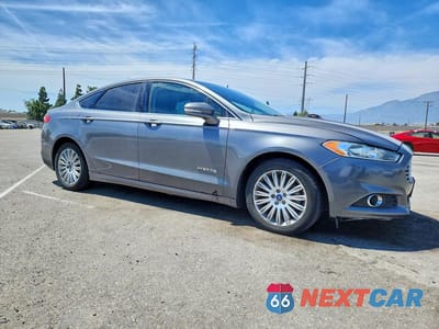 Czwarte zdjęcie samochodu z boku: 2014 FORD FUSION SE HYBRID VIN:3FA6P0LU2ER195519 - miniatura