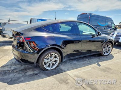 Trzecie zdjęcie samochodu z tyłu: 2023 TESLA MODEL Y VIN:7SAYGDEE2PA042210 - miniatura