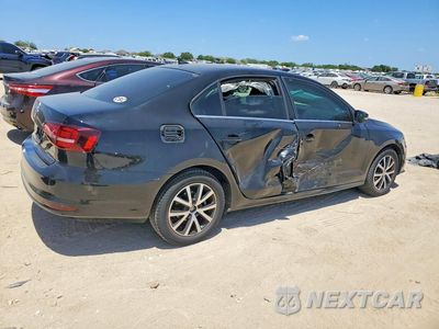 Trzecie zdjęcie samochodu z tyłu: 2017 VOLKSWAGEN JETTA SE VIN:3VWB67AJ2HM236209 - miniatura