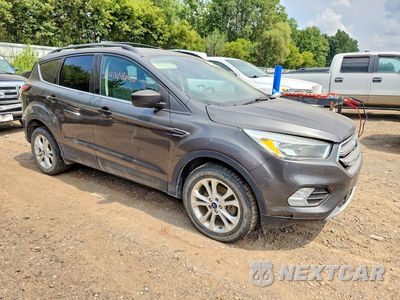 Czwarte zdjęcie samochodu z boku: 2017 FORD ESCAPE SE VIN:1FMCU9G92HUB07299 - miniatura