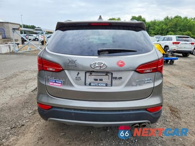 Zdjęcie 6 z 13 samochodu: 2014 HYUNDAI SANTA FE SPORT 2.0T VIN:5XYZWDLA2EG219187 - miniatura