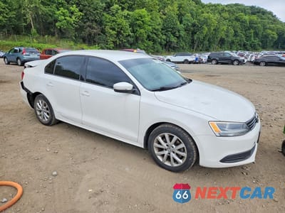 Czwarte zdjęcie samochodu z boku: 2011 VOLKSWAGEN JETTA SE VIN:3VWDZ7AJ7BM109480 - miniatura