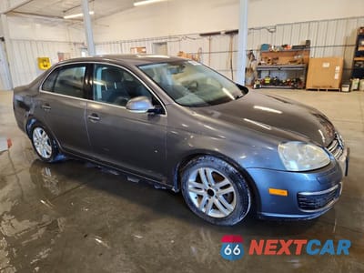 Czwarte zdjęcie samochodu z boku: 2005 VOLKSWAGEN NEW JETTA TDI OPTION PACKAGE 1 VIN:3VWST71K25M644173 - miniatura