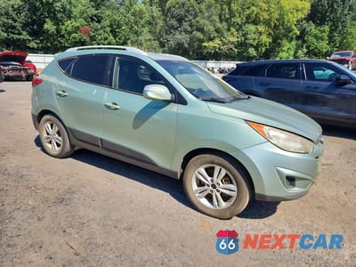 Czwarte zdjęcie samochodu z boku: 2012 HYUNDAI TUCSON GLS VIN:KM8JU3AC8CU454606 - miniatura