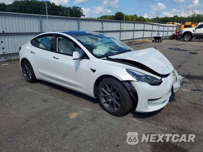 Czwarte zdjęcie samochodu z boku: 2023 TESLA MODEL 3 VIN:5YJ3E1EB3PF603051 - miniatura