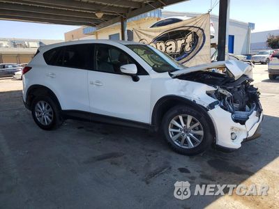 Czwarte zdjęcie samochodu z boku: 2016 MAZDA CX-5 TOURING VIN:JM3KE2CY1G0921345 - miniatura