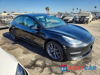 Czwarte zdjęcie samochodu z boku: 2023 TESLA MODEL 3 VIN:5YJ3E1EA9PF453390 - miniatura