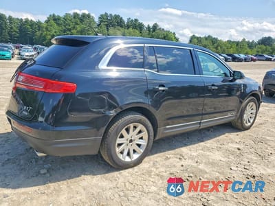 Trzecie zdjęcie samochodu z tyłu: 2017 LINCOLN MKT VIN:2LMHJ5NK9HBL00282 - miniatura