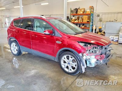 Czwarte zdjęcie samochodu z boku: 2016 FORD ESCAPE TITANIUM VIN:1FMCU0JX7GUA19947 - miniatura