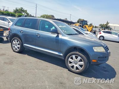 Czwarte zdjęcie samochodu z boku: 2004 VOLKSWAGEN TOUAREG 4.2 VIN:WVGCM77LX4D077284 - miniatura