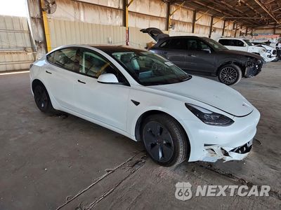 Czwarte zdjęcie samochodu z boku: 2023 TESLA MODEL 3 VIN:5YJ3E1EB4PF388862 - miniatura