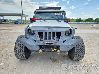 Piąte zdjęcie samochodu w środku: 2015 JEEP WRANGLER UNLIMITED SPORT VIN:1C4BJWDG8FL549291 - miniatura