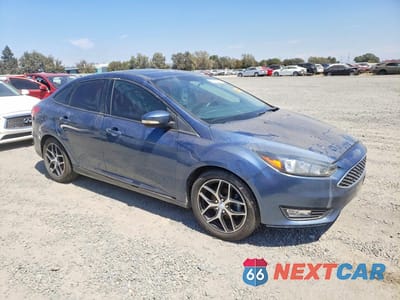 Czwarte zdjęcie samochodu z boku: 2018 FORD FOCUS SEL VIN:1FADP3H22JL204941 - miniatura