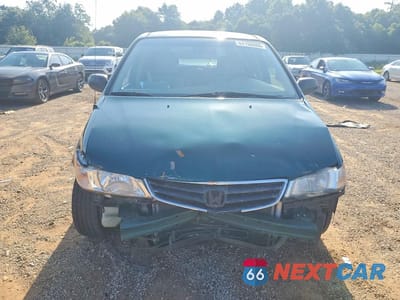 Piąte zdjęcie samochodu w środku: 2002 HONDA ODYSSEY LX VIN:2HKRL18522H574609 - miniatura