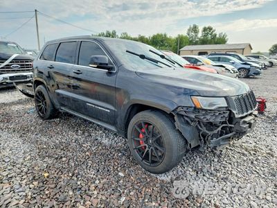 Czwarte zdjęcie samochodu z boku: 2014 JEEP GRAND CHEROKEE SRT-8 VIN:1C4RJFDJ5EC169821 - miniatura