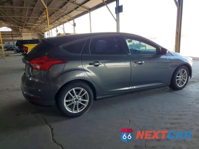 Trzecie zdjęcie samochodu z tyłu: 2017 FORD FOCUS SE VIN:1FADP3K29HL216572 - miniatura