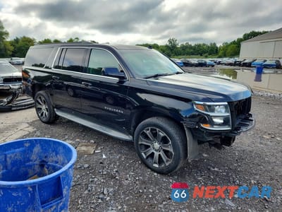 Czwarte zdjęcie samochodu z boku: 2015 CHEVROLET SUBURBAN K1500 LT VIN:1GNSKJKC2FR174986 - miniatura
