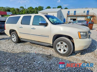 Czwarte zdjęcie samochodu z boku: 2009 CHEVROLET SUBURBAN K1500 LTZ VIN:1GNFK36339R234561 - miniatura