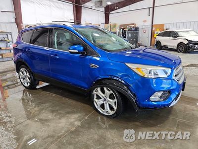 Czwarte zdjęcie samochodu z boku: 2017 FORD ESCAPE TITANIUM VIN:1FMCU0JD0HUE54364 - miniatura