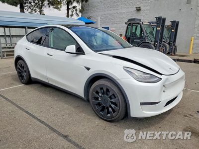 Czwarte zdjęcie samochodu z boku: 2023 TESLA MODEL Y VIN:7SAYGDEE4PA112404 - miniatura