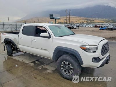 Czwarte zdjęcie samochodu z boku: 2020 TOYOTA TACOMA TRD OFF-ROAD VIN:3TMDZ5BN1LM090760 - miniatura