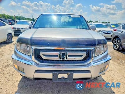 Piąte zdjęcie samochodu w środku: 2011 HONDA RIDGELINE RTL VIN:5FPYK1F56BB004099 - miniatura