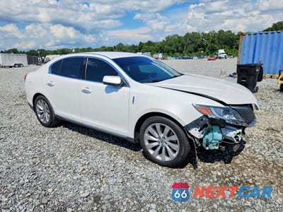 Czwarte zdjęcie samochodu z boku: 2014 LINCOLN MKS VIN:1LNHL9EK2EG604801 - miniatura