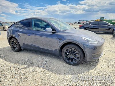 Czwarte zdjęcie samochodu z boku: 2023 TESLA MODEL Y VIN:7SAYGDEE7PA205434 - miniatura