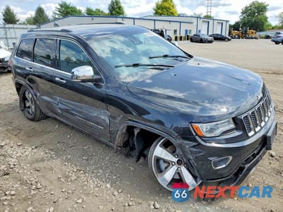 Czwarte zdjęcie samochodu z boku: 2014 JEEP GRAND CHEROKEE OVERLAND VIN:1C4RJFCG1EC409257 - miniatura