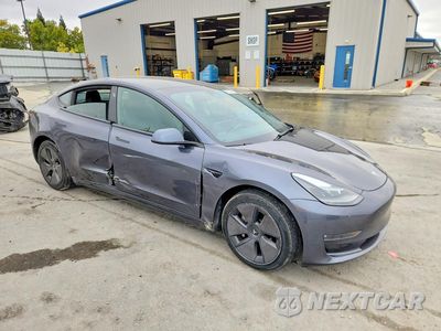 Czwarte zdjęcie samochodu z boku: 2023 TESLA MODEL 3 VIN:5YJ3E1EB8PF387066 - miniatura