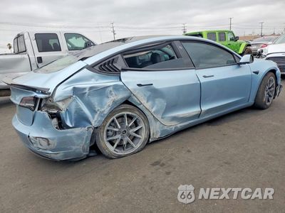 Trzecie zdjęcie samochodu z tyłu: 2021 TESLA MODEL 3 VIN:5YJ3E1EA6MF099114 - miniatura