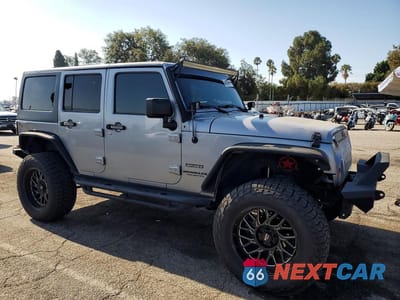 Czwarte zdjęcie samochodu z boku: 2014 JEEP WRANGLER UNLIMITED SPORT VIN:1C4HJWDG1EL237368 - miniatura